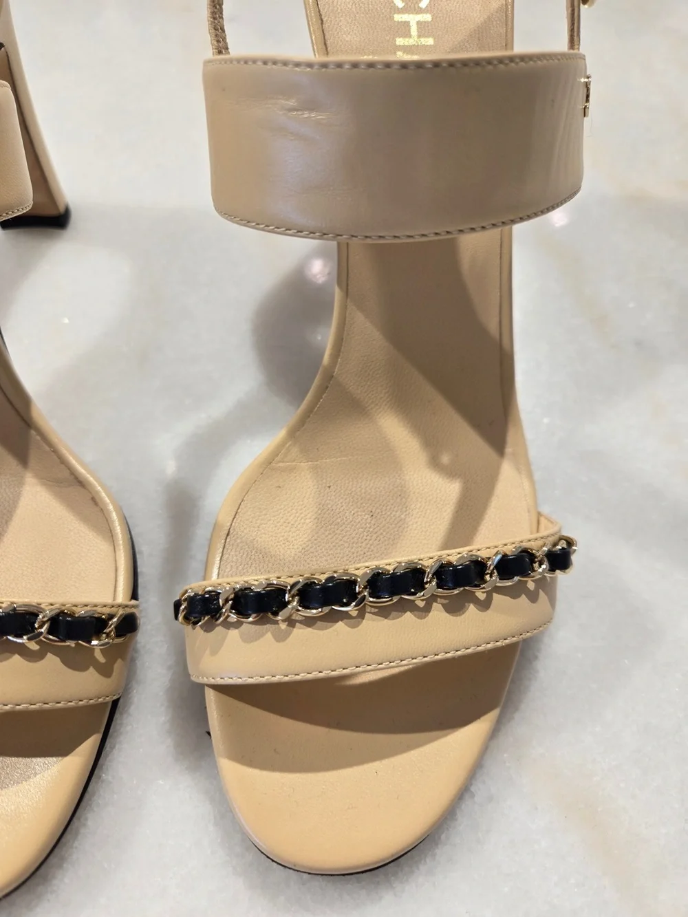 CHANEL Beige Slingback Heels with Black-and-Gold Chain